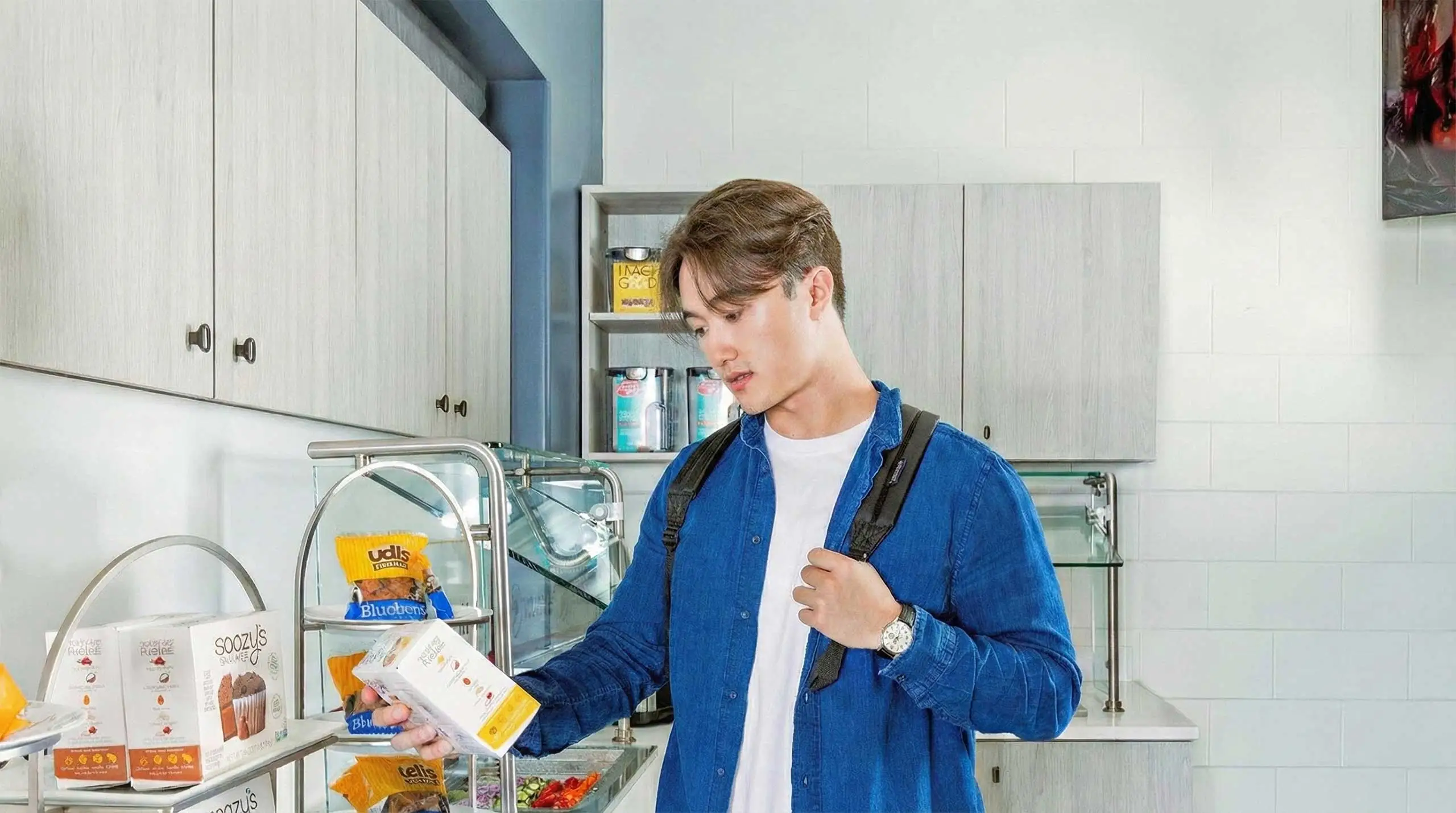 Student looking at packaged food in an allergy free dining hall line